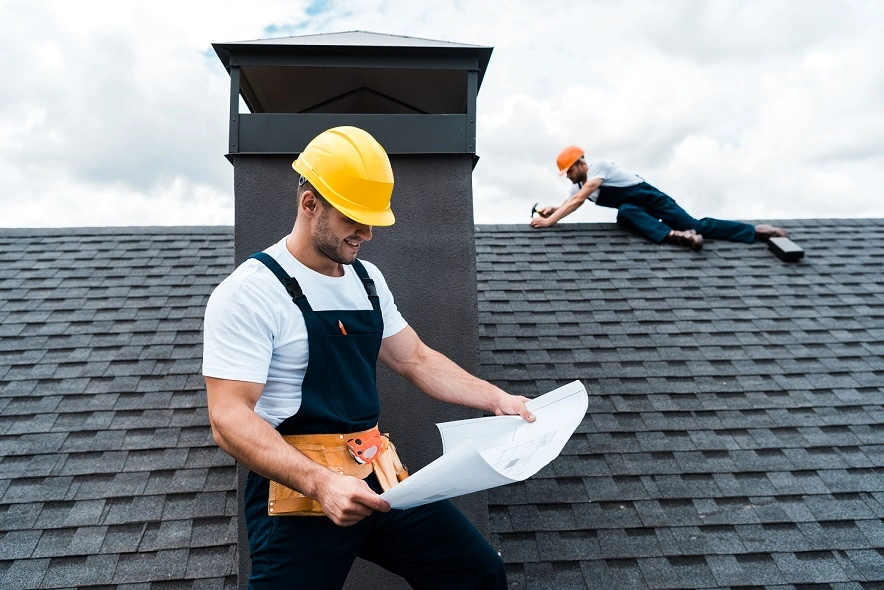 selective-focus-of-handsome-builder-in-helmet-hold-2022-12-16-21-23-57-utc